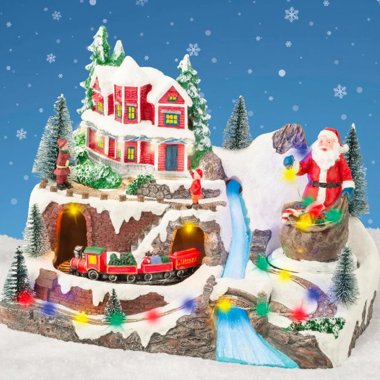 Village de Noël lumineux et musical Père Noël en montagne